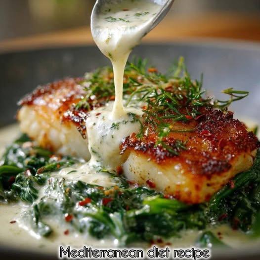 Pan-Seared Cod with Garlic Cream Sauce over Sautéed Spinach